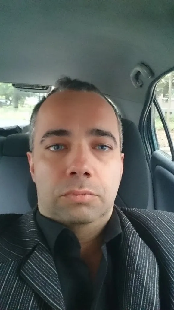 Ivan Pasev driving, portrait oriented.